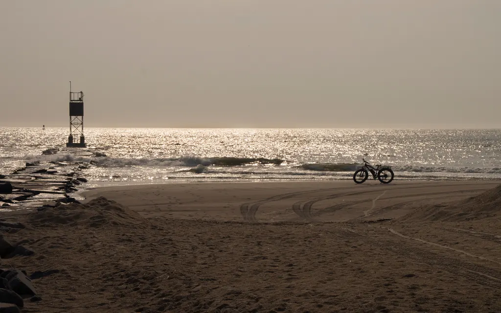 Fat-tire bike on a Delaware beach at sunrise